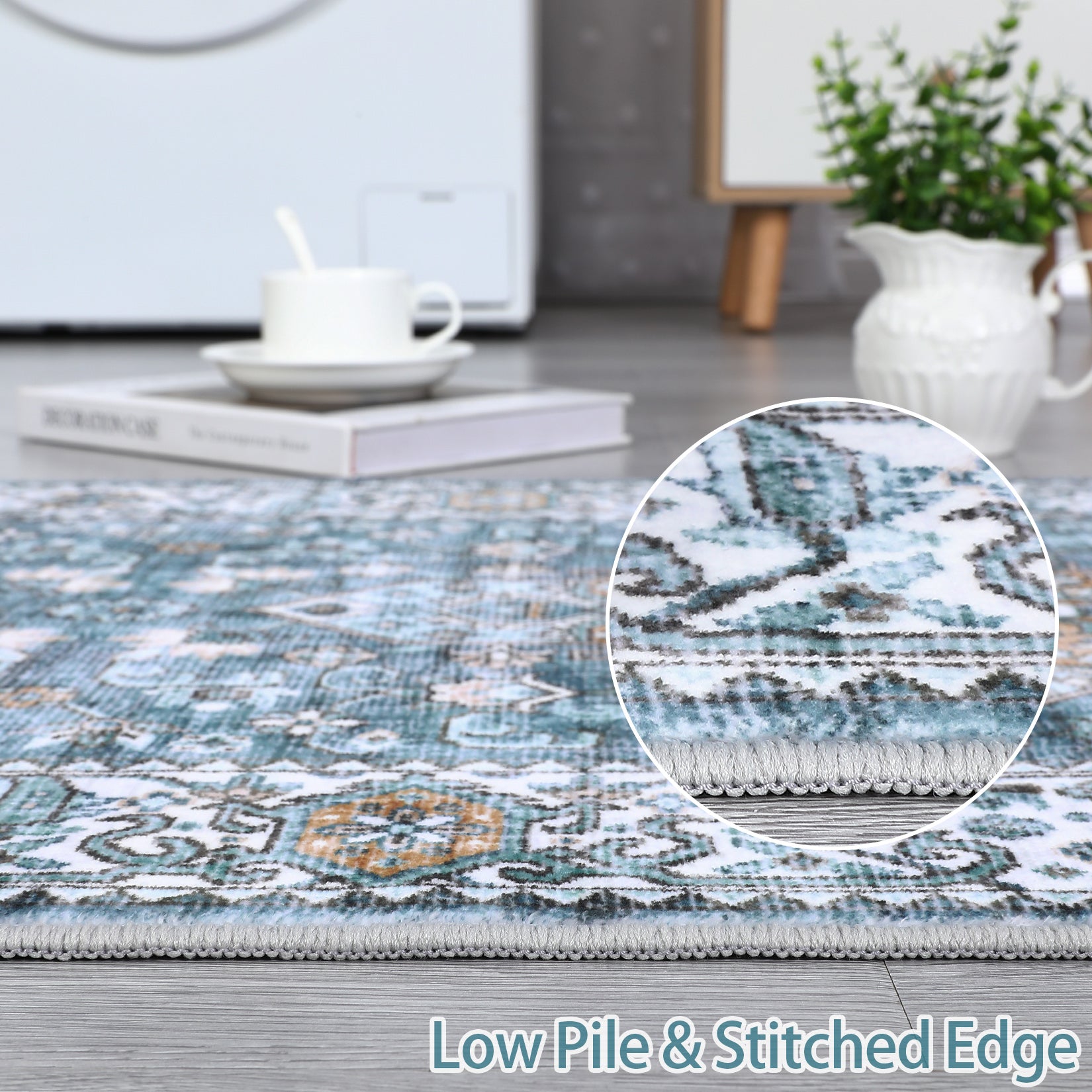 Blue floral area rug close detail showing low pile and stitched edge