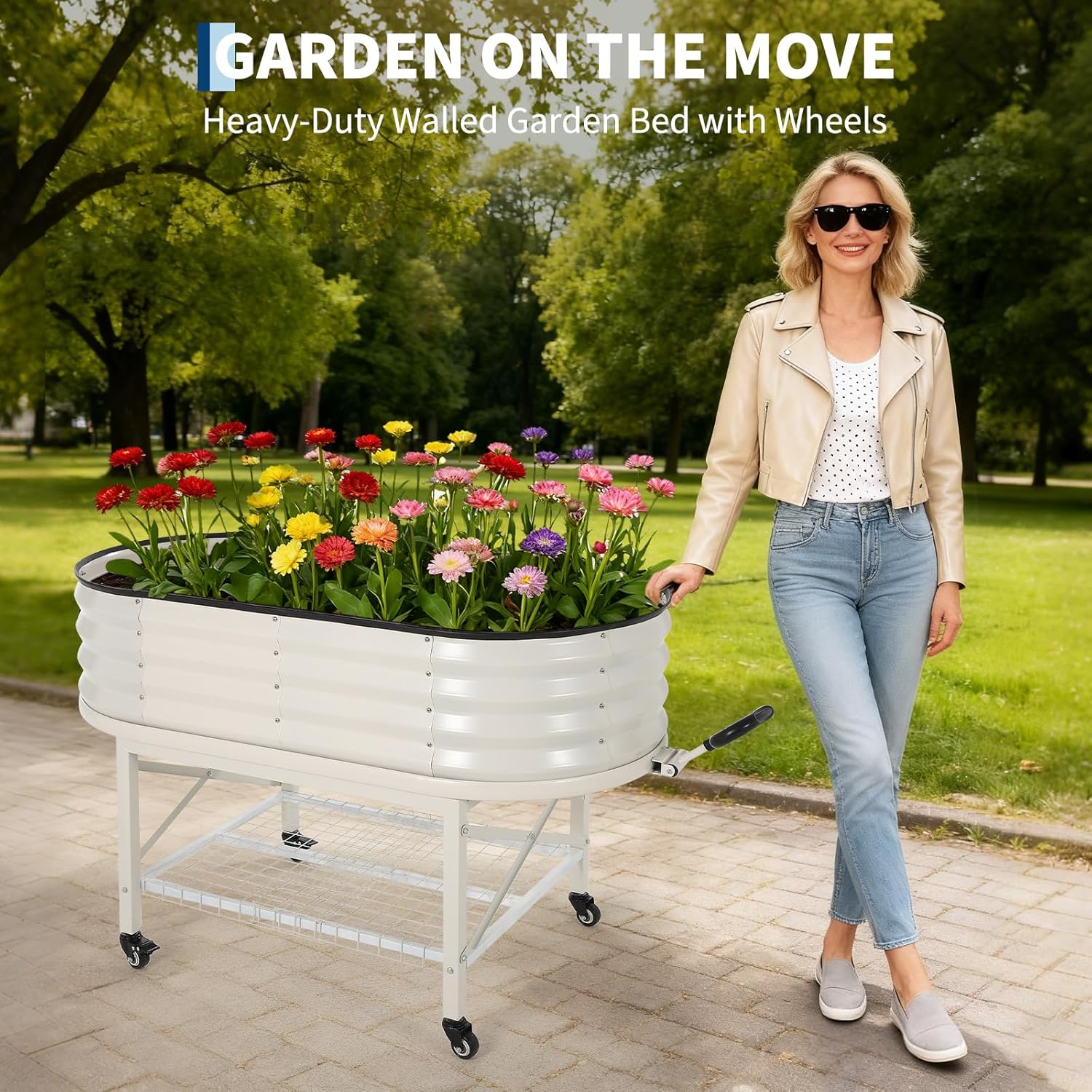 Beige mobile oval raised garden bed being moved with a pull handle and caster wheels