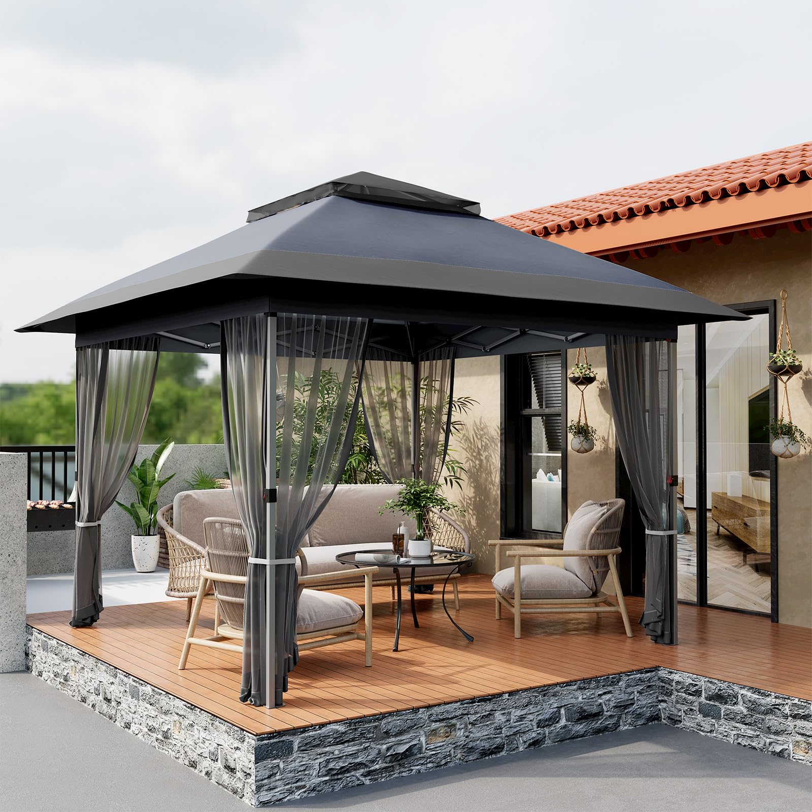 Gray softtop gazebo with mosquito netting on patio seating area