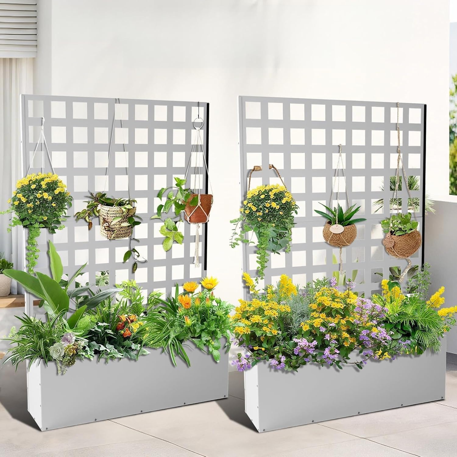 two white metal raised garden beds with square grid trellises and colorful plant displays