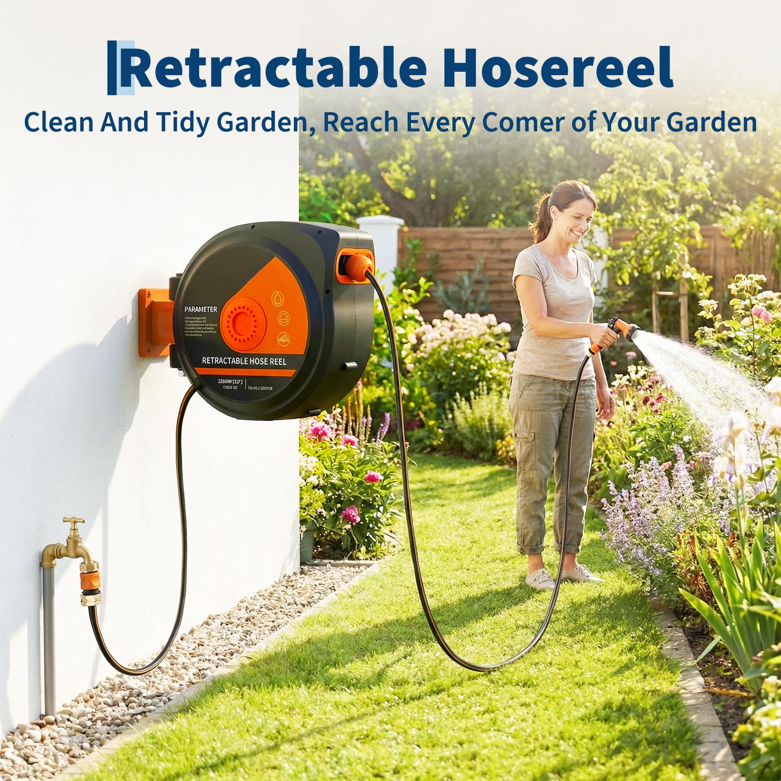 Wall mounted black and orange retractable hose reel watering flowers across a garden
