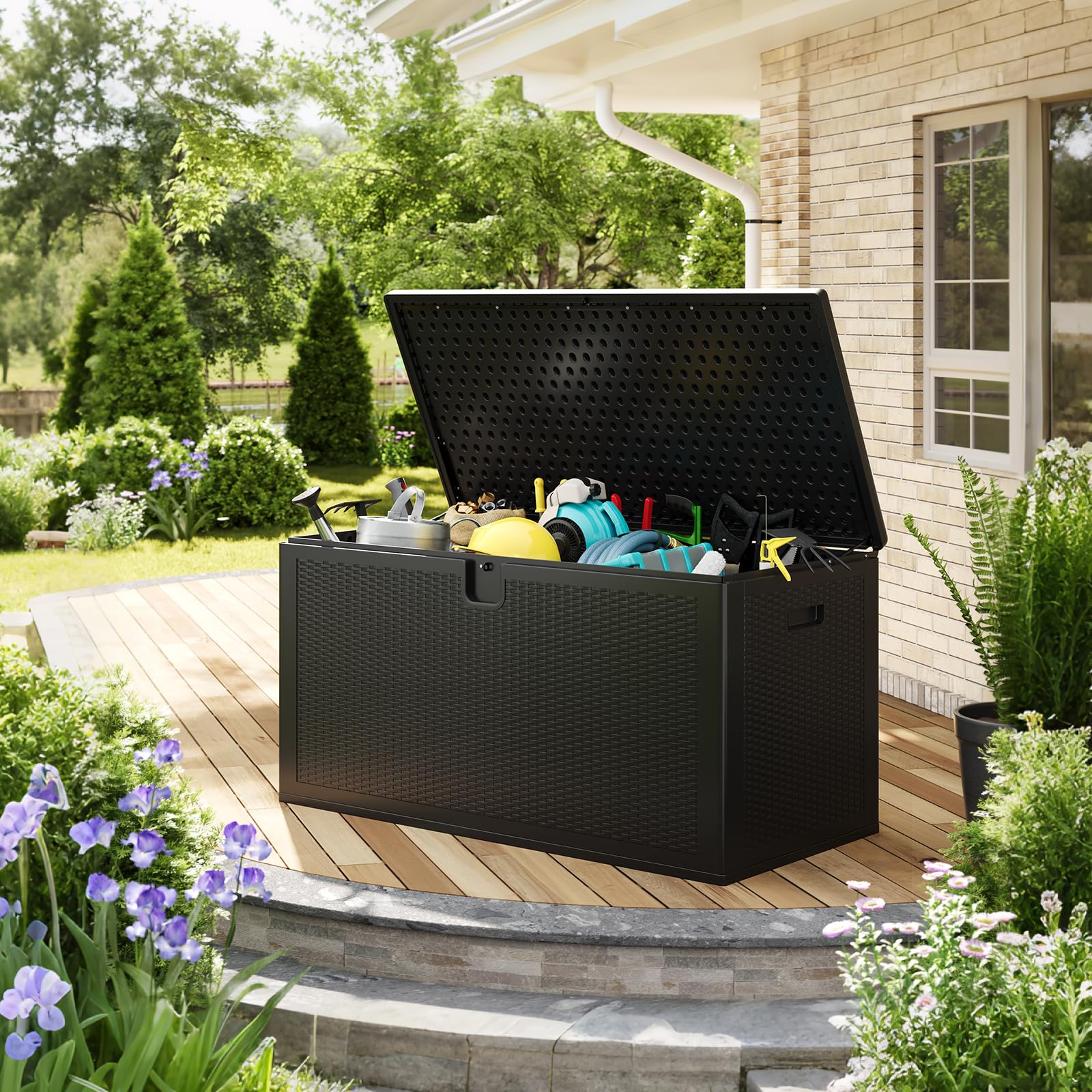 open black 150 Gal resin deck box holding patio cushions and outdoor accessories in a garden