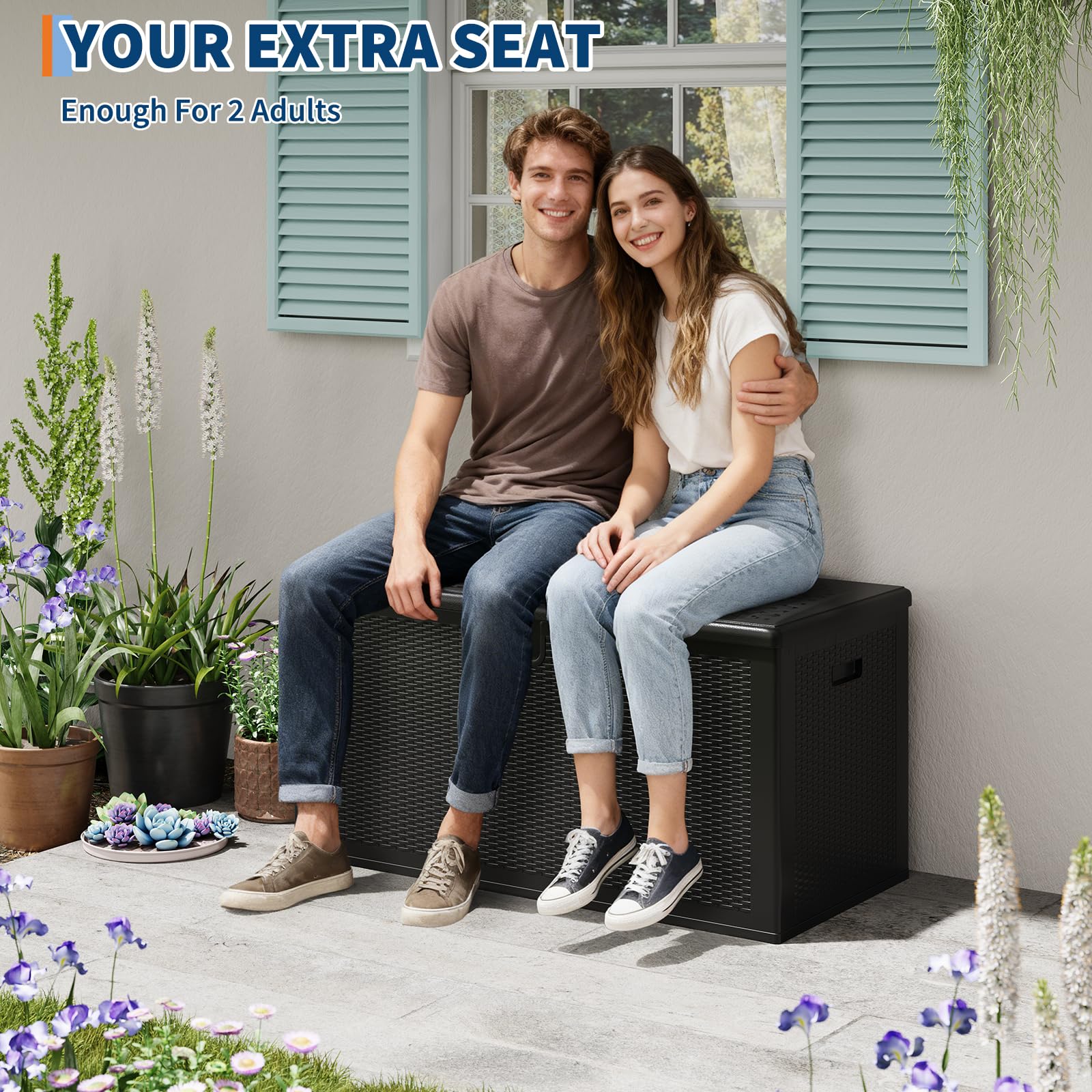 two adults seated on the closed lid of a black 150 Gal resin deck box
