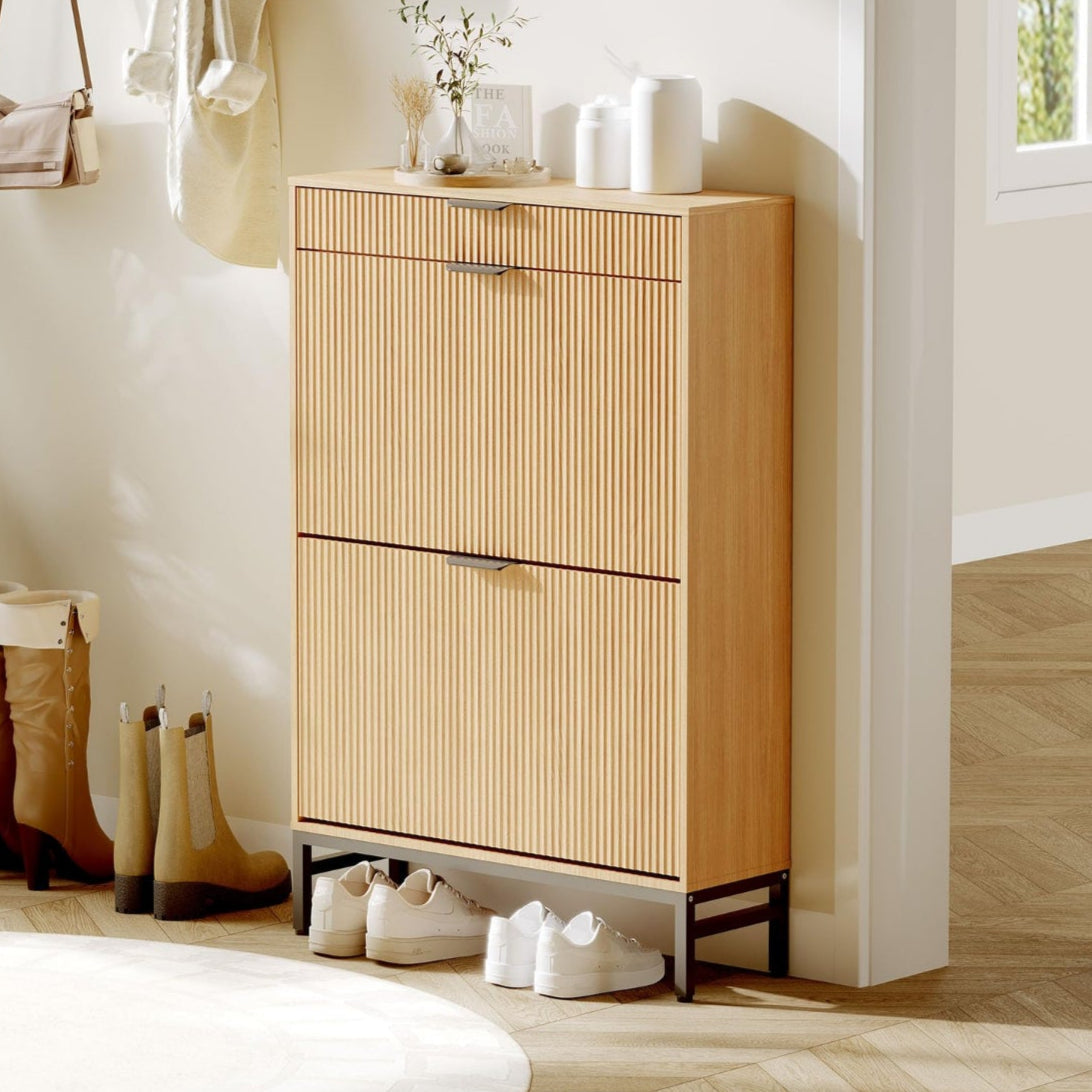 Slim oak shoe cabinet with fluted front in an entryway