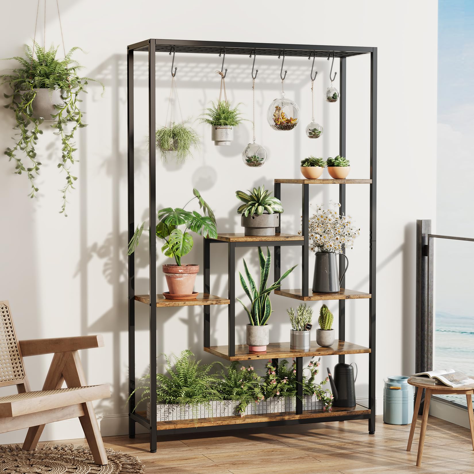 Brown wood grain and black metal 5 tier plant stand displaying potted and hanging plants in a bright room
