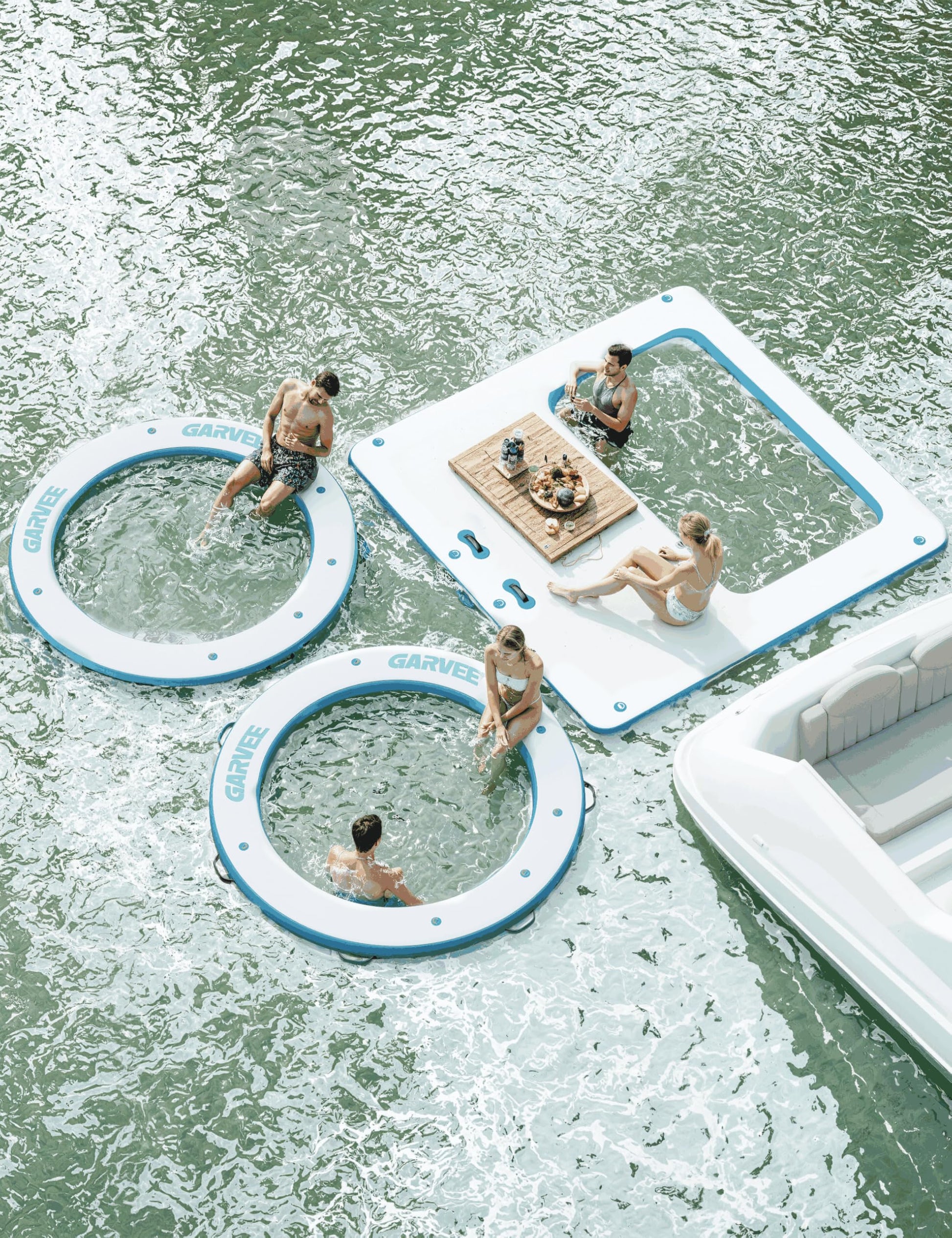 Multiple inflatable water platforms connected together on the water