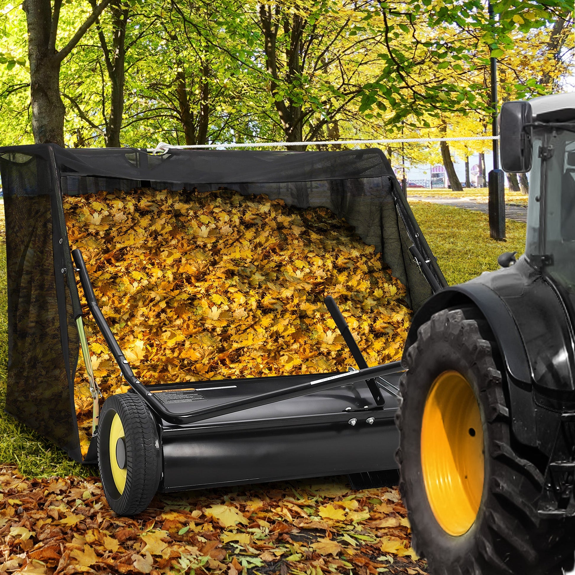 Large capacity hopper collecting leaves while towing