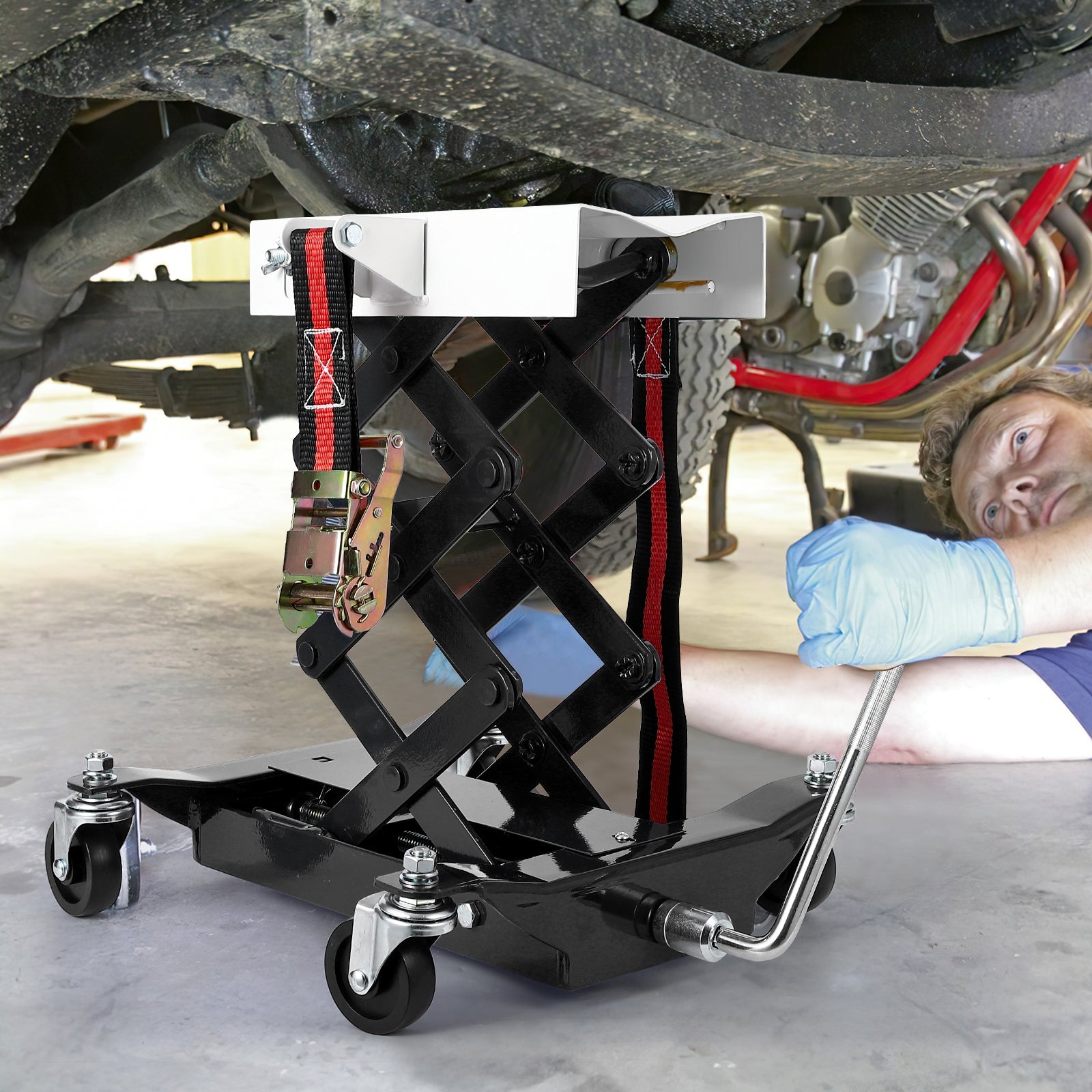 Low profile scissor lift transmission jack in use