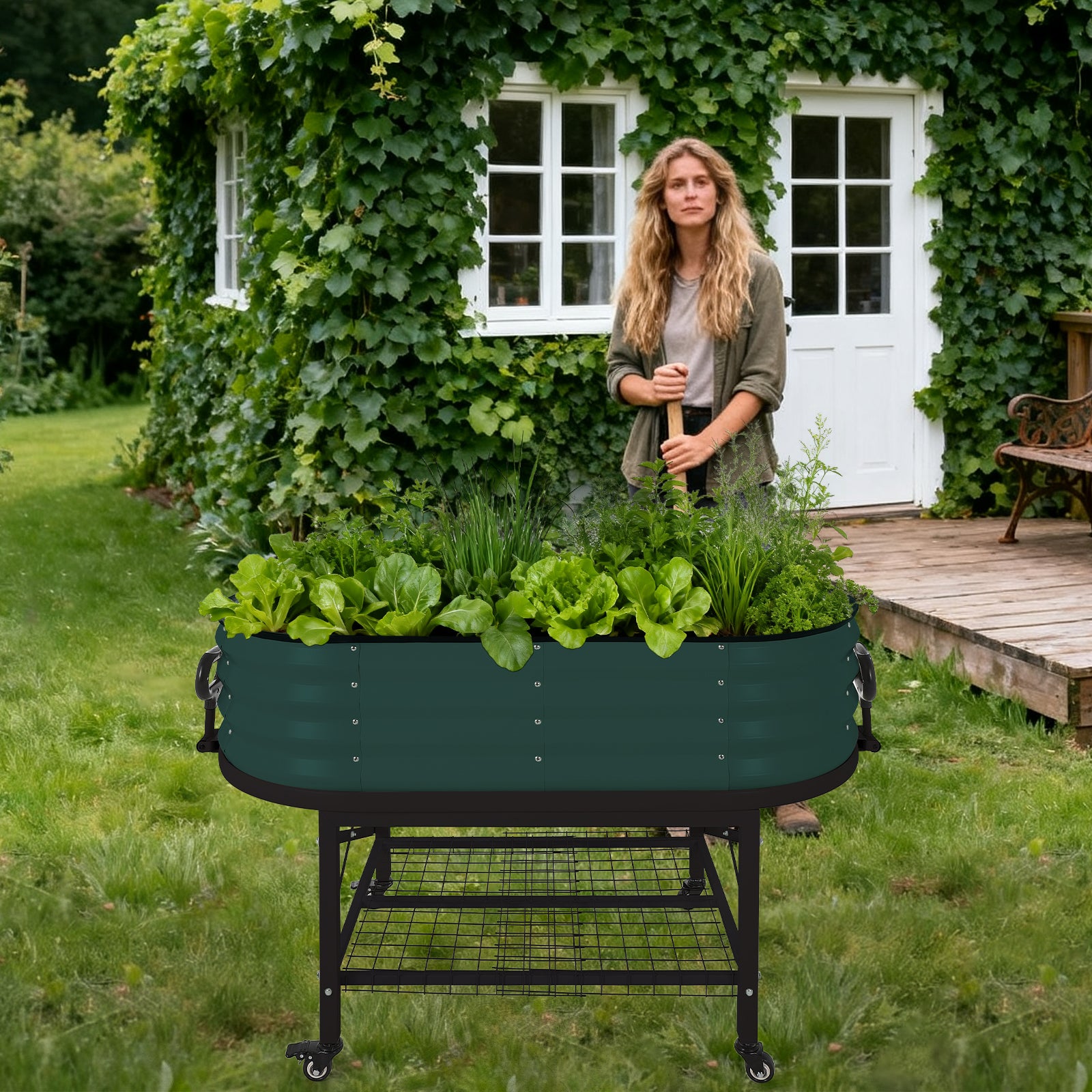Dark green elevated oval raised garden bed with lower wire shelf in an outdoor garden