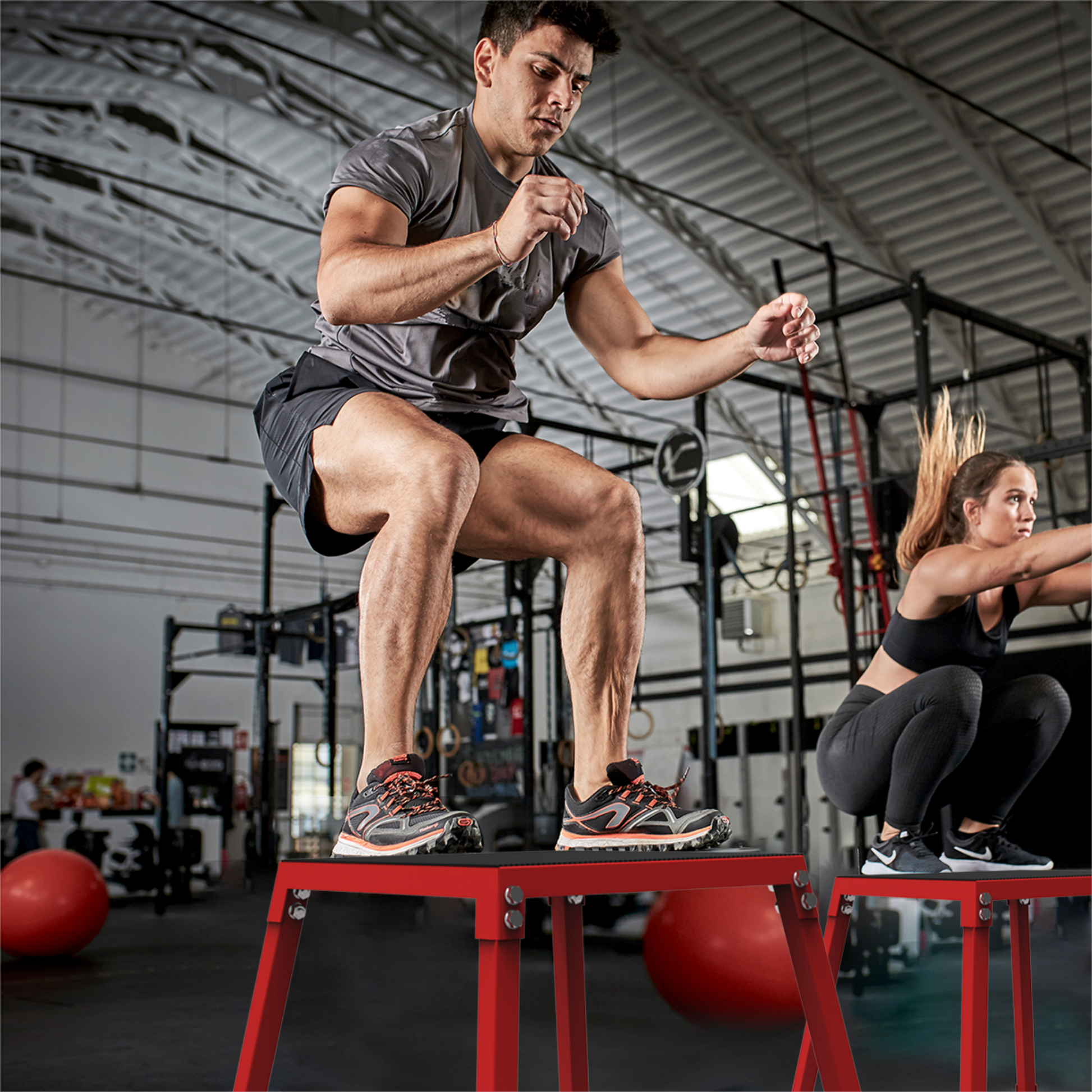 Athletes using plyometric jump boxes for training